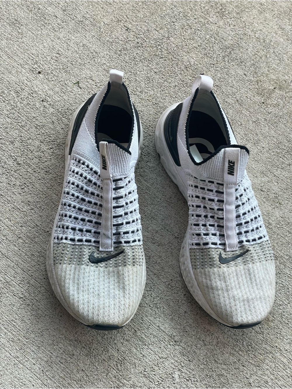Nike Men’s White and Black Slip-On Knit Sneakers